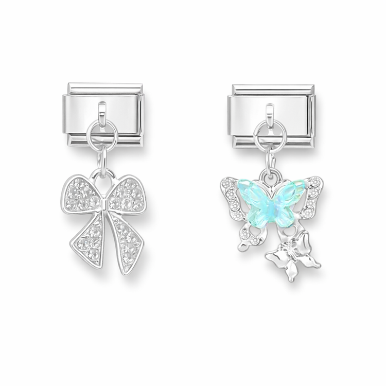 Italian bracelet link charms with dangling designs, including a crystal-studded bow and a butterfly charm with pale blue wings
