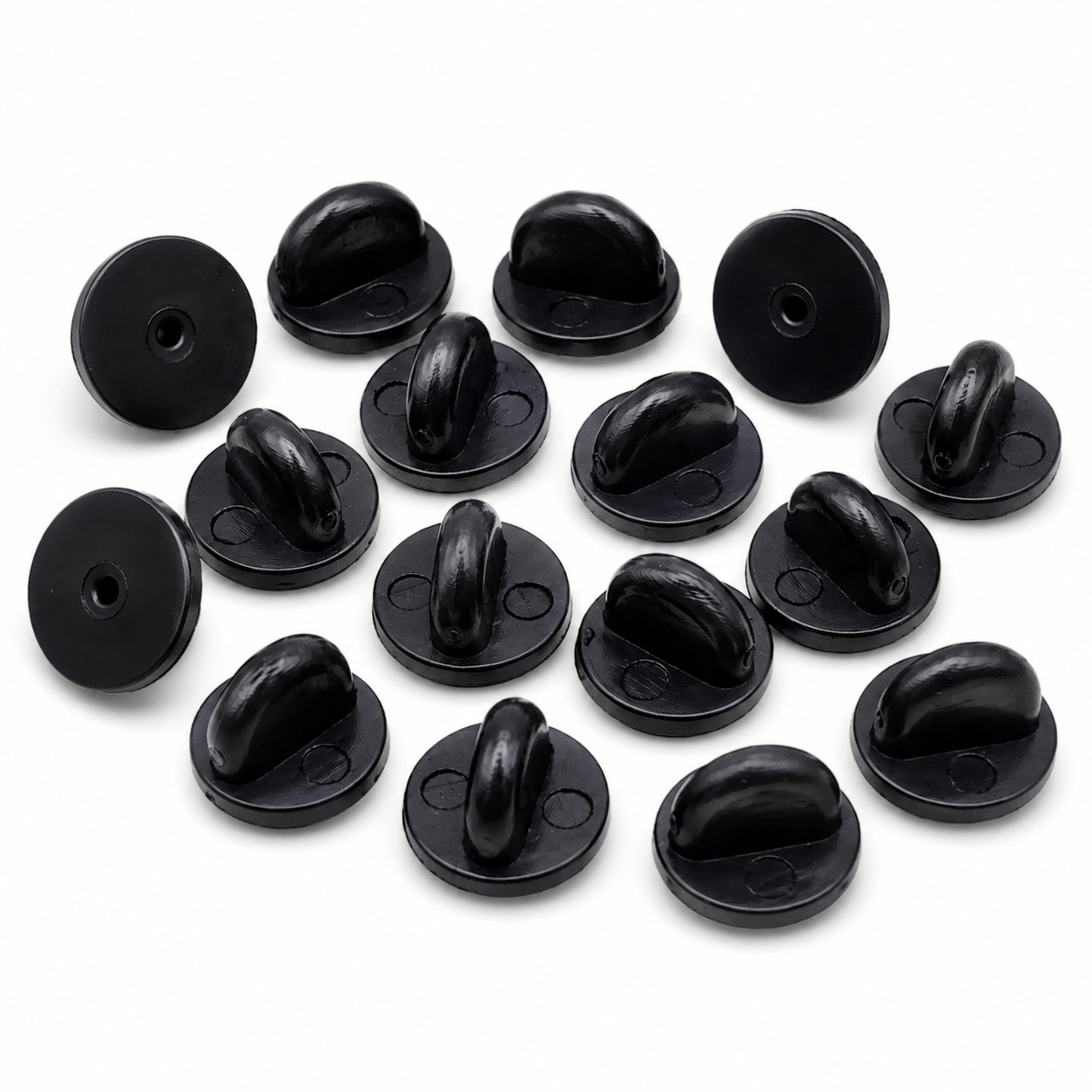 Set of black rubber pin backs, rounded grips with circular mounting holes