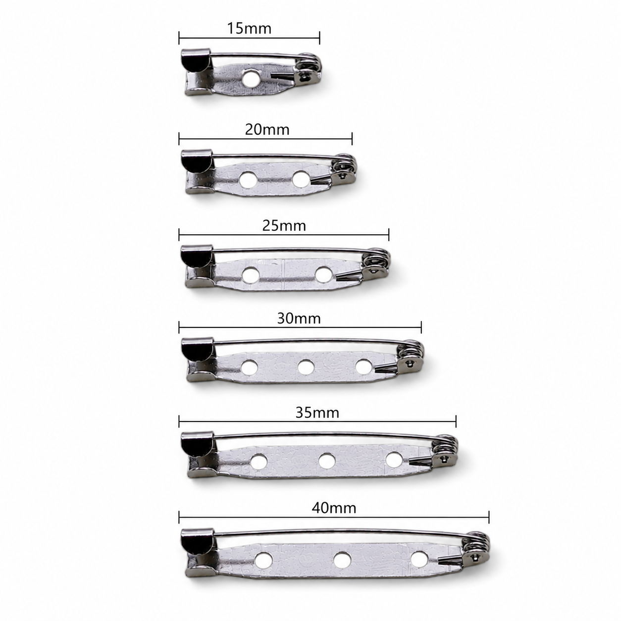 Assorted silver brooch pin backs, mixed lengths 15–40mm with safety clasp