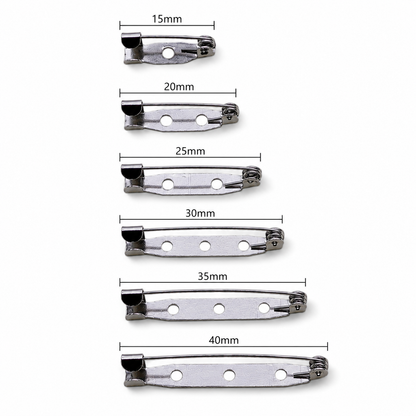 Assorted silver brooch pin backs, mixed lengths 15–40mm with safety clasp