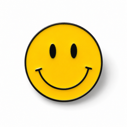 Yellow smiley face enamel pin badge with black smile, eyes, and border