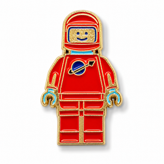 Red and blue spaceman enamel pin with gold outline, mini astronaut badge