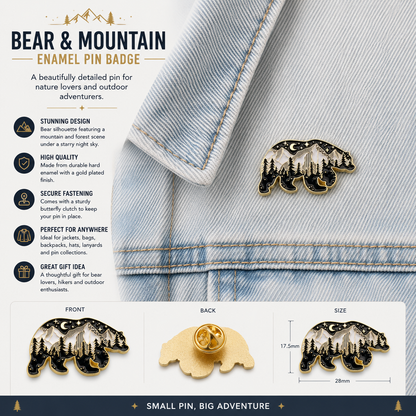 Small black-and-gold bear enamel pin with forest trees and a moon backdrop