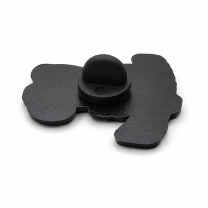 Enamel pin badge backing with black clasp on dark otter-shaped piece
