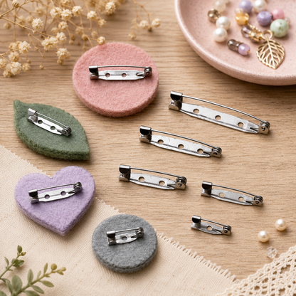 Steel bar pin backs attached to felt hearts, with round hole rows and clasps