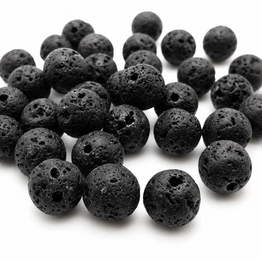 Black round lava stone beads heap, rough speckled texture with center drilled holes