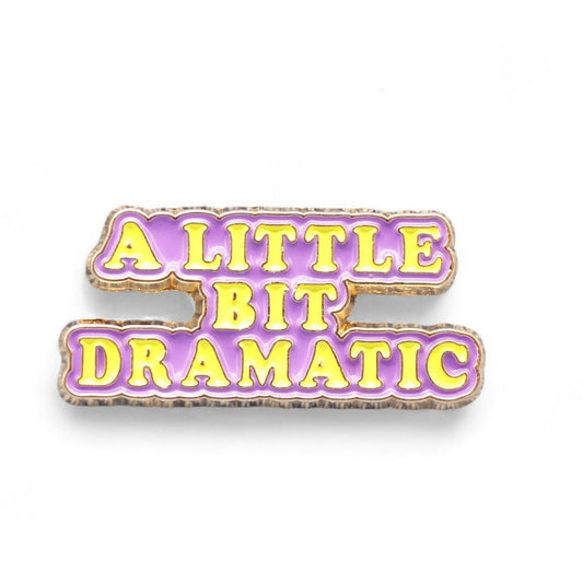 Lilac yellow and gold enamel pin badge with the text a little bit dramatic 