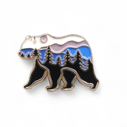 Bear-shaped enamel pin with mountain and sky design