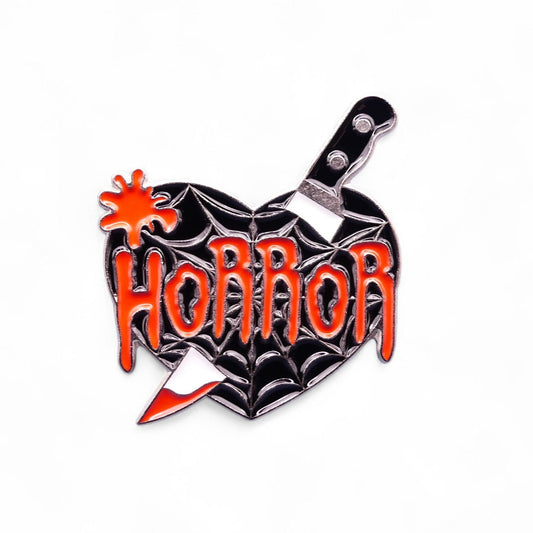 black heart with text horror with a knife enamel pin badge 
