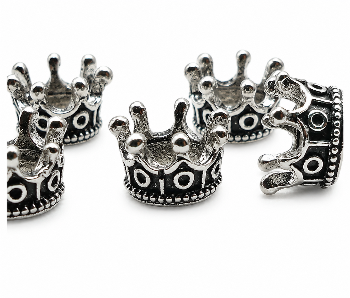 Crown spacer beads in antique silver tone, multiple views with hole at each crown base