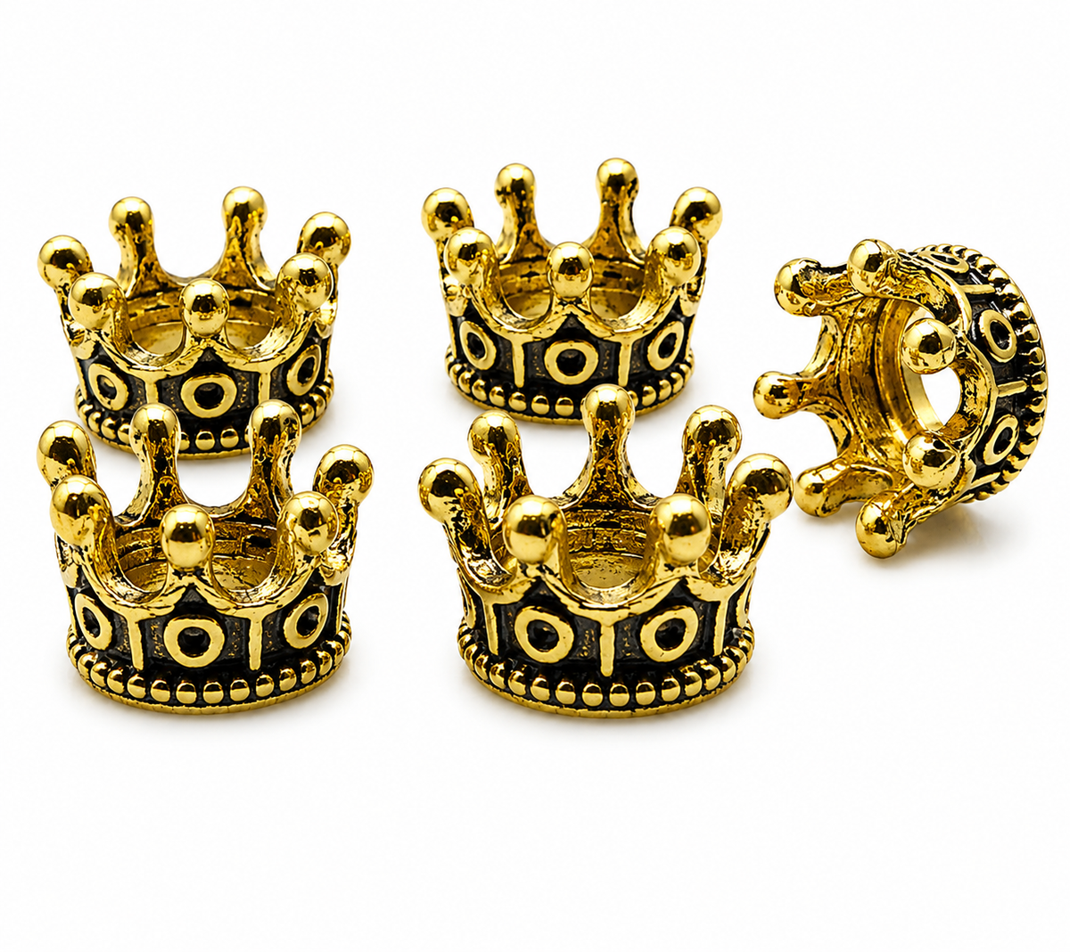 Gold tone crown spacer beads with dark inlay motifs and protruding crown tips