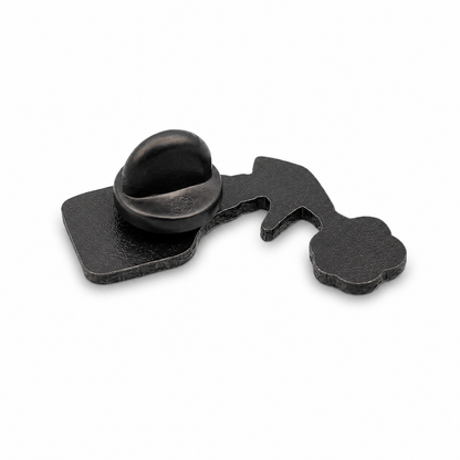 Back of enamel pin badge with black rubber clutch and metal post on silver backing