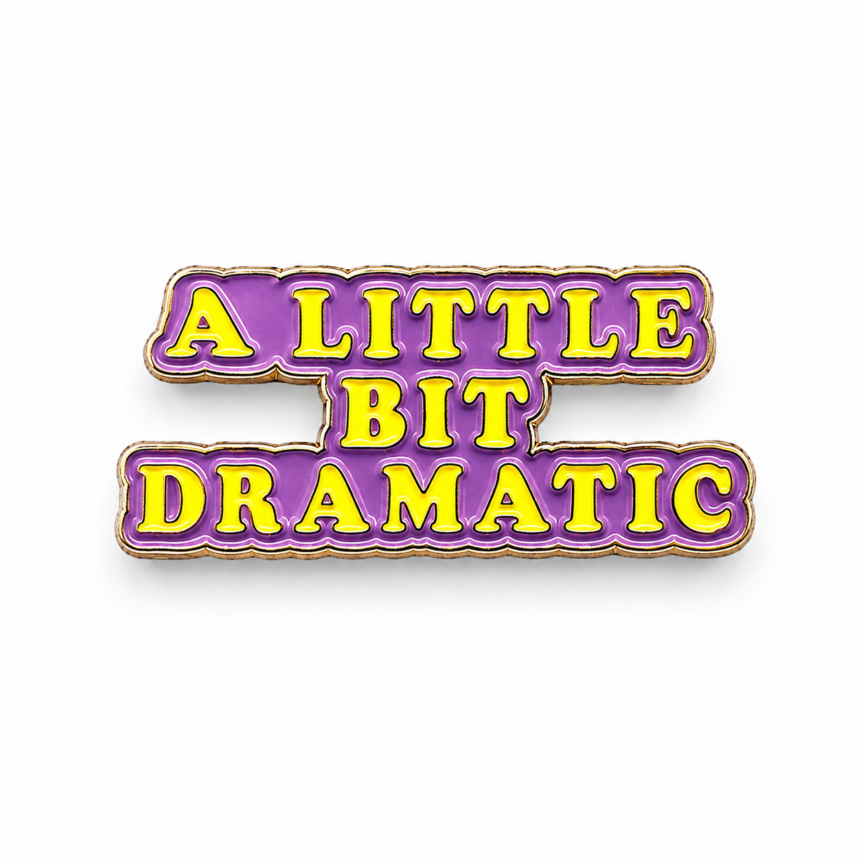 Purple enamel text badge pin reading “A LITTLE BIT DRAMATIC” with gold border.