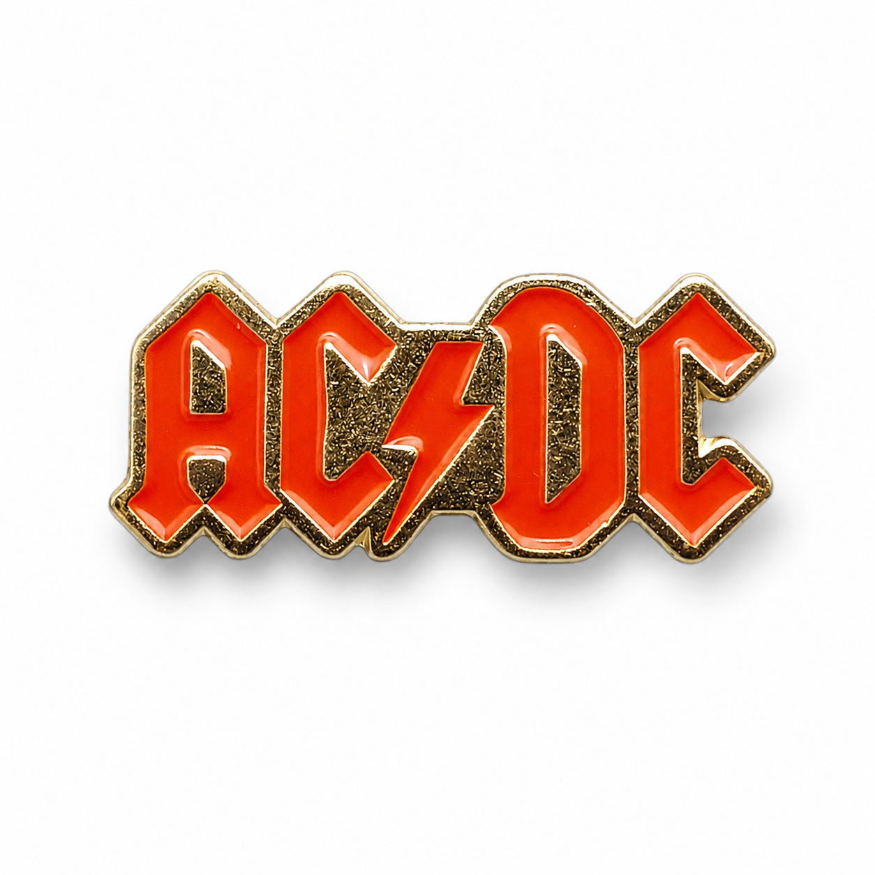 AC/DC enamel pin badge with red letters and gold outline, metal backing pin stem