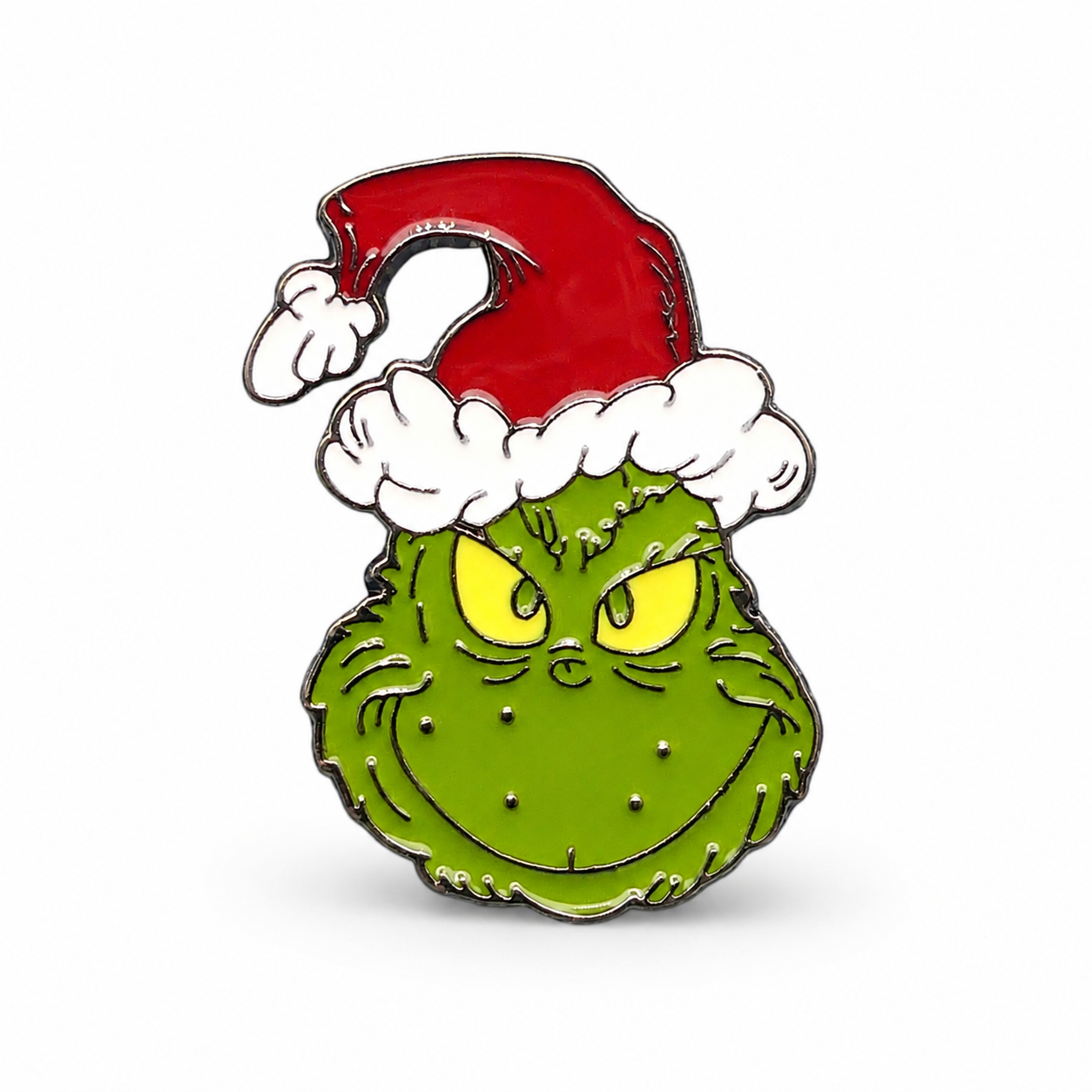 Green enamel pin badge of grumpy character with red Santa hat and white beard