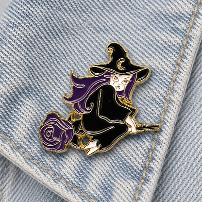 Enamel witch pin badge with purple hair and purple rose detail on denim