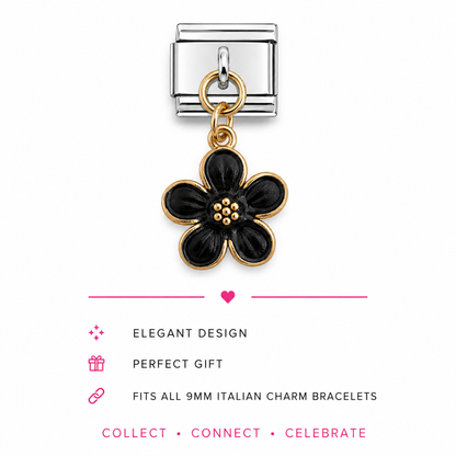 A silver-toned Italian charm link featuring a dangling five-petal flower charm with black enamel and gold-toned metal borders.