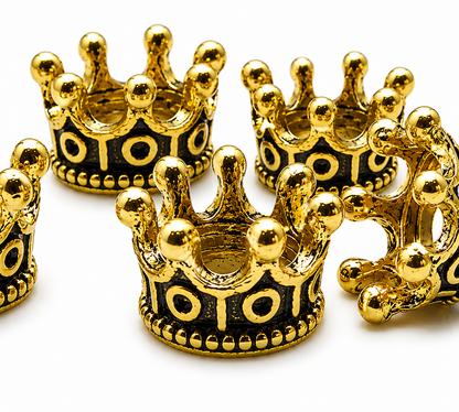 Cluster of gold tone crown spacer beads with dark inlay motifs and rounded studs