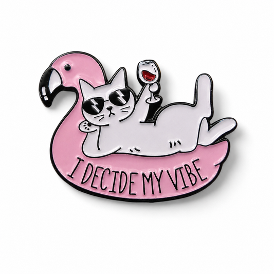 Pink cat on flamingo float enamel pin badge with 'I Decide My Vibe' slogan