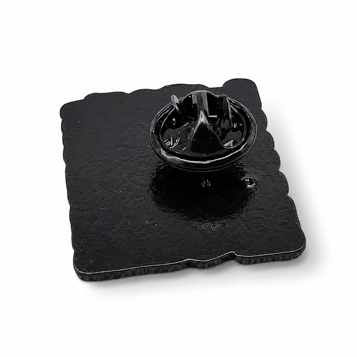 Enamel pin badge with black backing and metal clasp hardware