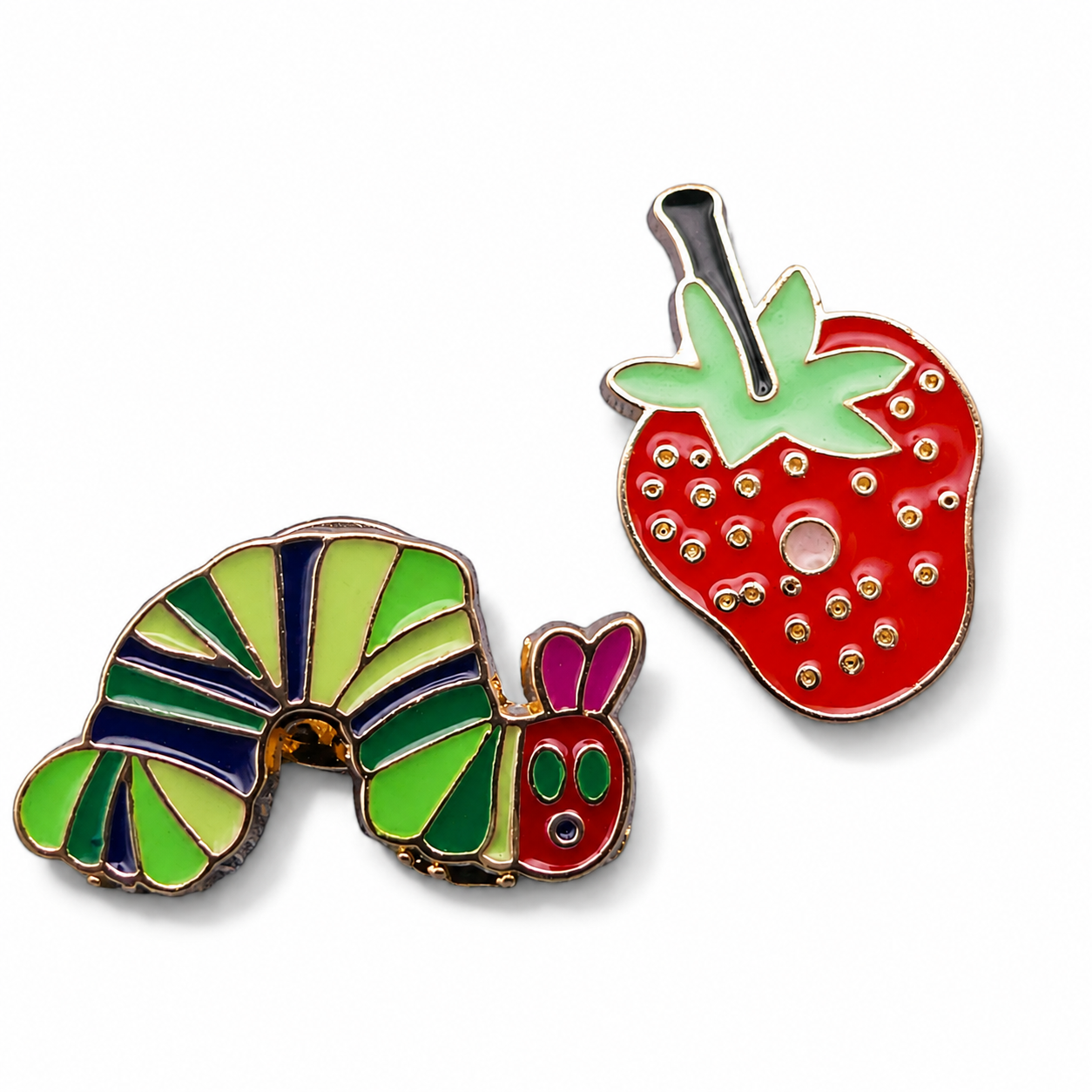 Colorful strawberry and caterpillar enamel pin badges with gold-tone posts