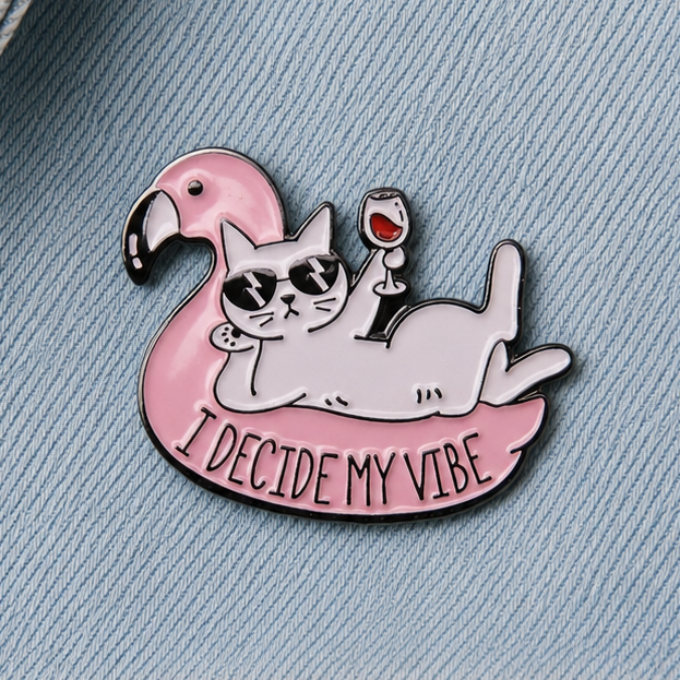 Pink cat on flamingo float enamel pin badge, 'I Decide My Vibe' slogan close-up