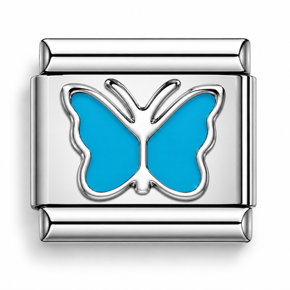 Blue butterfly charm with turquoise enamel wings and silver raised butterfly design