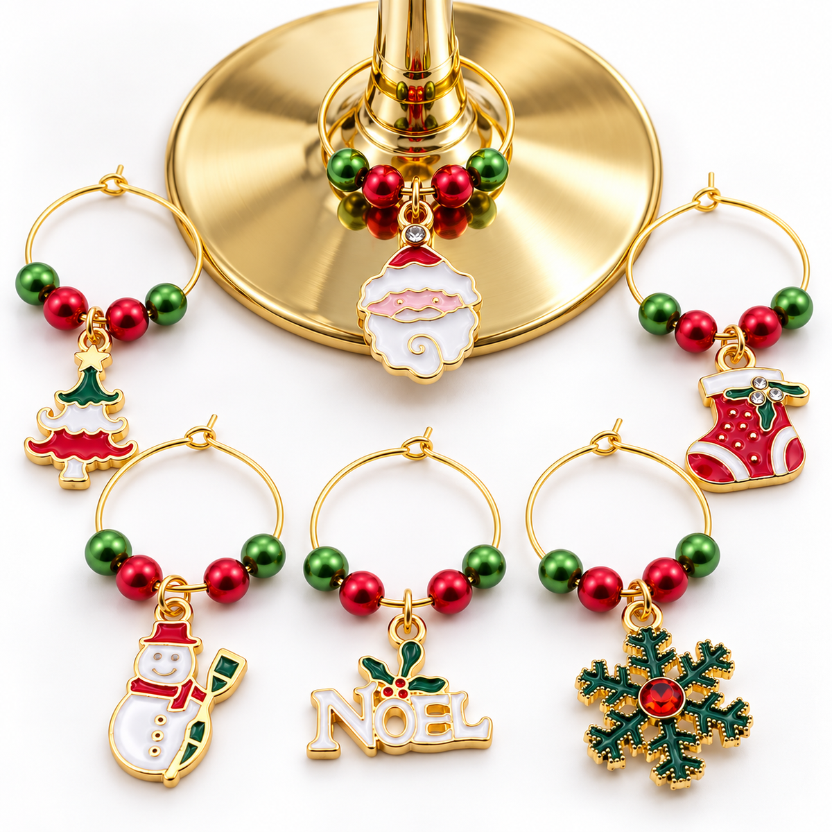 Gold-toned wine glass charm set of 6 with Noel sign, stocking, tree, snowman, ornament, snowflake