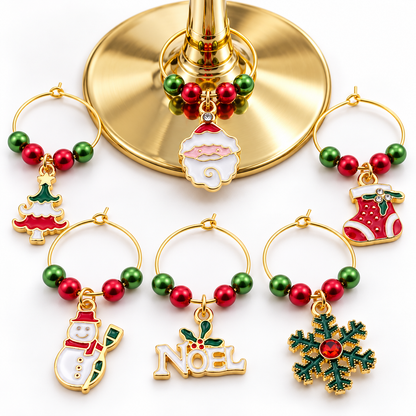 Gold-toned wine glass charm set of 6 with Noel sign, stocking, tree, snowman, ornament, snowflake