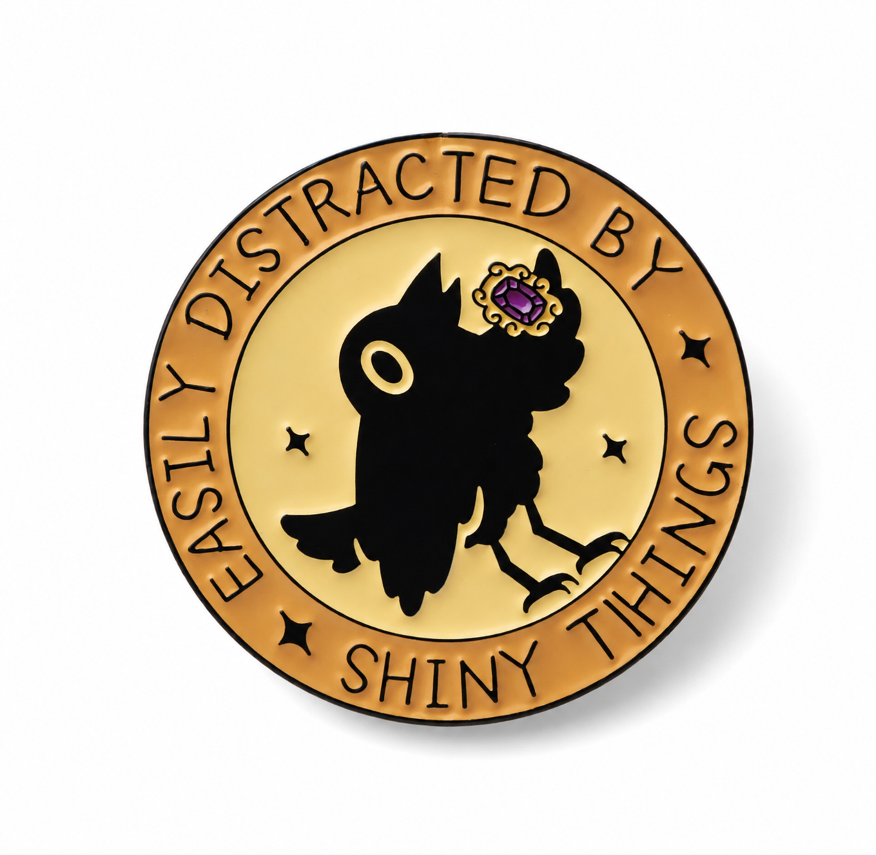 Round gold enamel pin with black crow silhouette and star text, purple flower accent