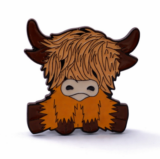Cartoon-style highland cow with brown hair and horns enamel pin badge 