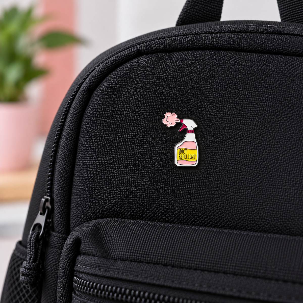 Cartoon spray bottle enamel pin badge with 'REPELLENT' text and pink character