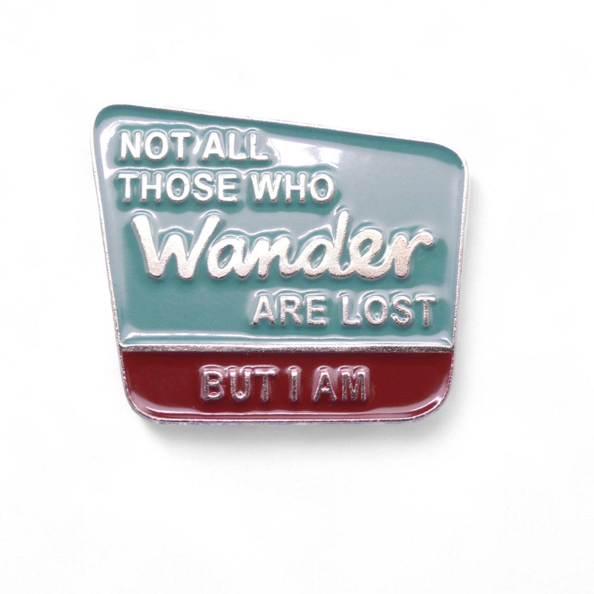 green and burgundy enamel pin badge with text Not All Those Who Wander Are Lost But I Am.
