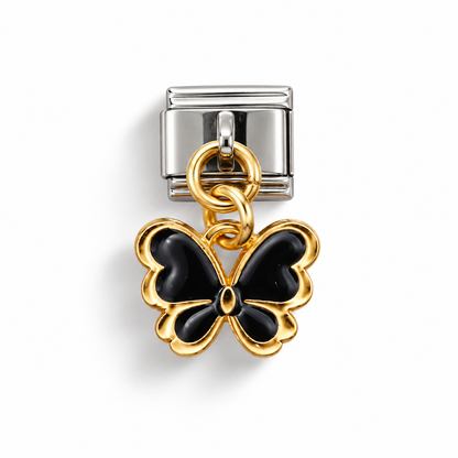 Black butterfly charm with gold-tone edging, hanging from a silver-tone Italian bracelet link