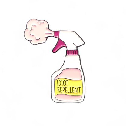 pink Spray bottle labelled 'Idiot Repellent' enamel pin badge 