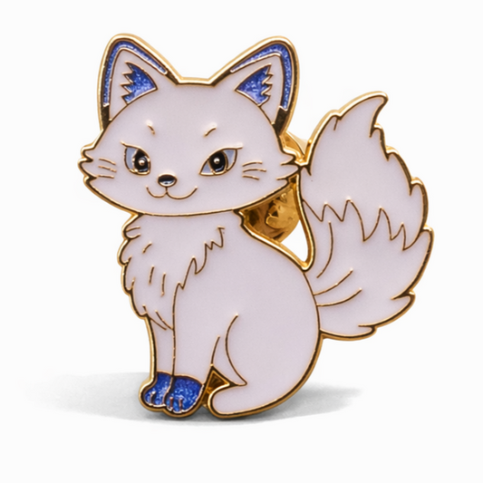 White fox-shaped enamel pin with gold and blue accents